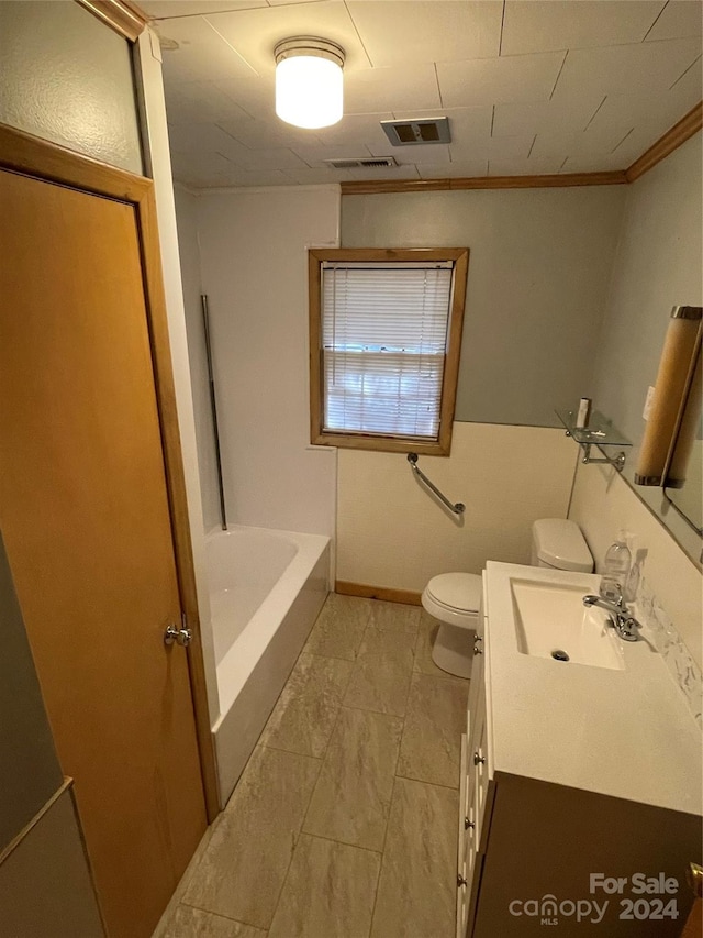 bathroom featuring vanity, toilet, and ornamental molding