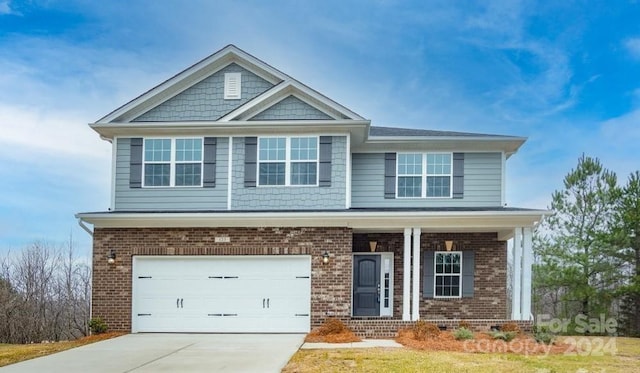 craftsman inspired home with a garage