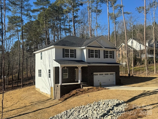 view of front of home with a garage and a porch