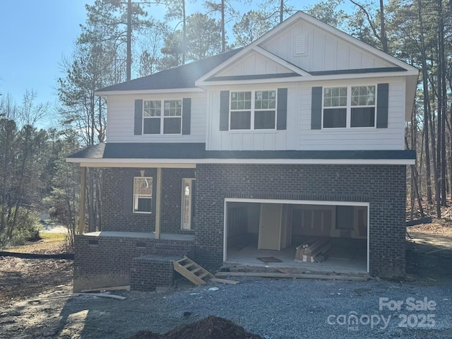 view of front facade featuring a garage and covered porch