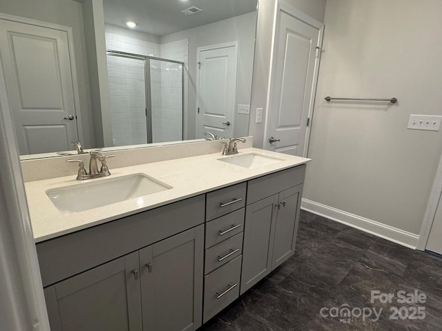 bathroom featuring vanity and a shower with shower door