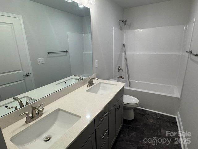 full bathroom featuring vanity, bathtub / shower combination, and toilet