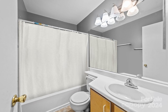 bathroom featuring tile patterned flooring, vanity, and toilet