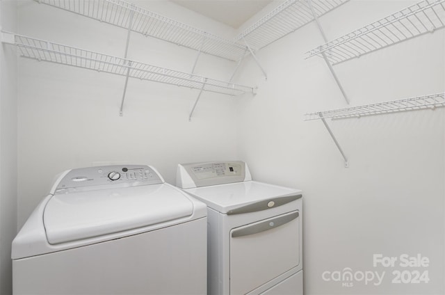 washroom with washer and dryer