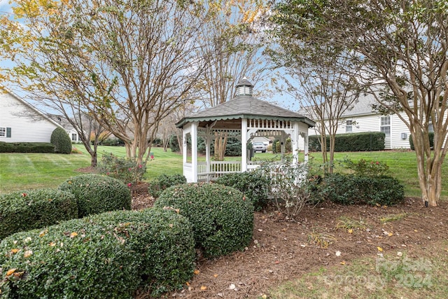 view of home's community with a gazebo and a lawn