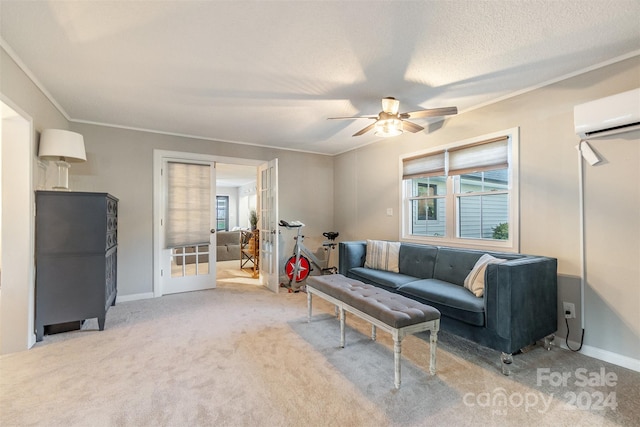 living room with ceiling fan, light colored carpet, an AC wall unit, and french doors