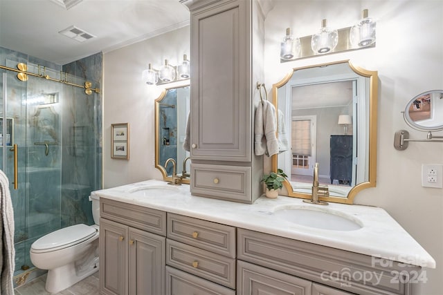 bathroom featuring vanity, toilet, an enclosed shower, and ornamental molding