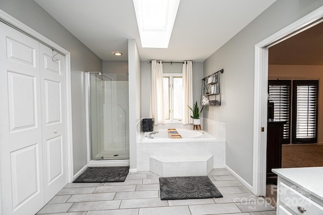 bathroom featuring tile patterned floors, a skylight, and plus walk in shower