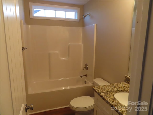 full bathroom with vanity, shower / bathing tub combination, and toilet