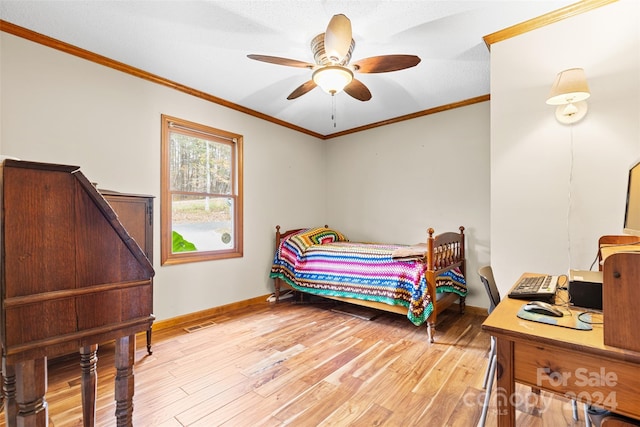 bedroom featuring ceiling fan, light hardwood / wood-style floors, and ornamental molding