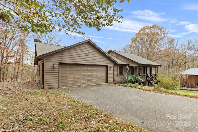 ranch-style home with a garage