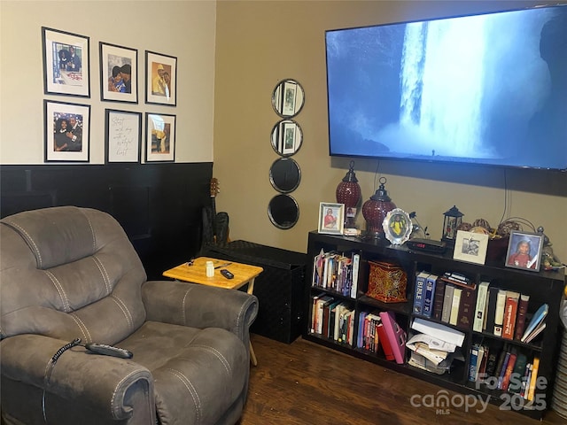 sitting room featuring dark hardwood / wood-style floors