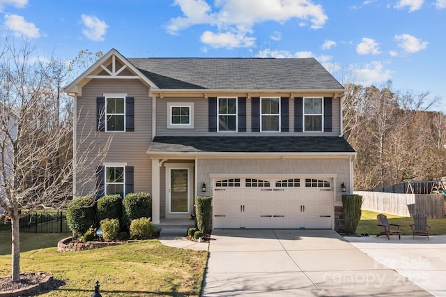 view of front of home featuring a garage and a front lawn