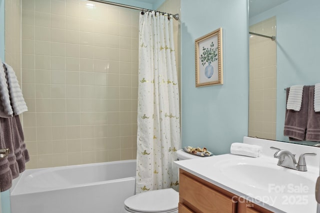 bathroom with shower / tub combo with curtain, vanity, and toilet