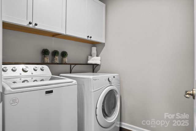 laundry room featuring cabinet space and washer and dryer