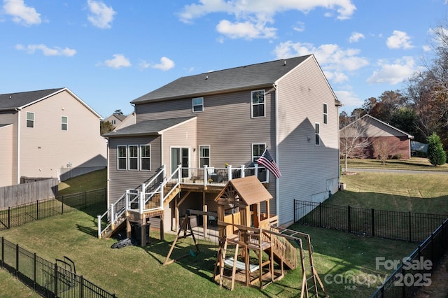 rear view of property with stairs, a yard, a playground, and a fenced backyard