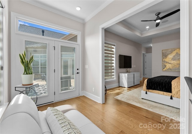 bedroom featuring ornamental molding, wood-type flooring, access to exterior, and ceiling fan