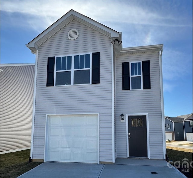 view of front of property featuring a garage and driveway