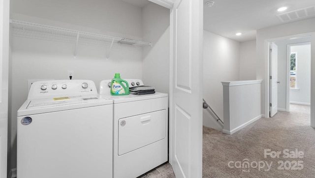 laundry room featuring laundry area, visible vents, light colored carpet, washing machine and clothes dryer, and recessed lighting