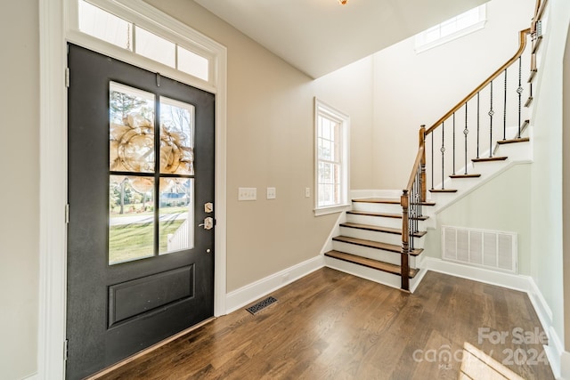 entrance foyer with dark hardwood / wood-style flooring