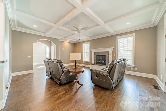 living room with beamed ceiling, dark hardwood / wood-style floors, and coffered ceiling