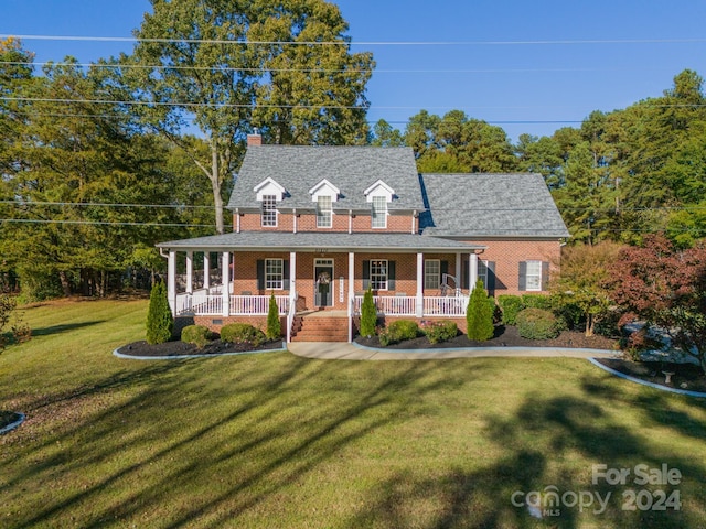 view of front of house featuring a porch and a front yard