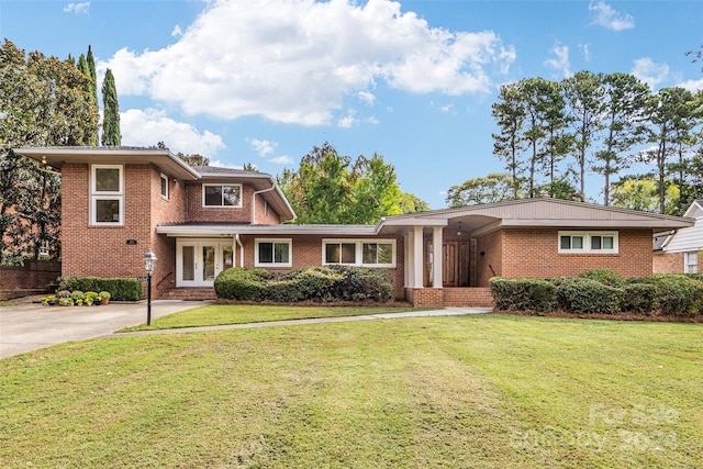 view of front of house featuring french doors and a front lawn