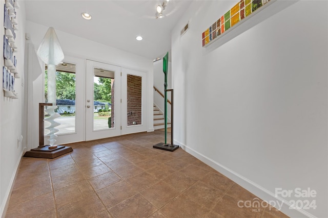 entryway featuring french doors