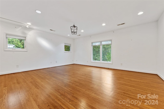 unfurnished room with light wood-type flooring