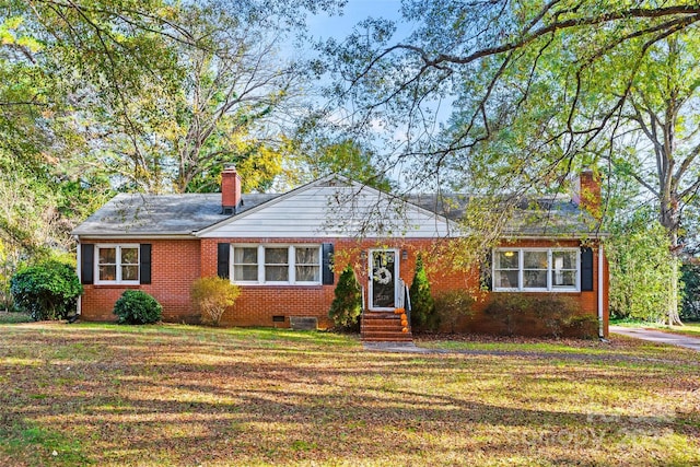 ranch-style home with a front lawn