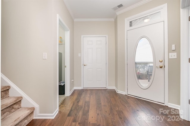 foyer entrance featuring dark hardwood / wood-style floors and ornamental molding