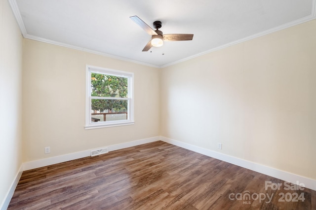 empty room featuring hardwood / wood-style flooring, ceiling fan, and crown molding