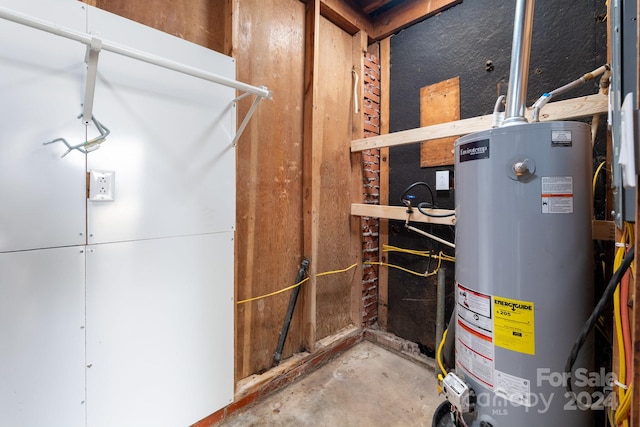 utility room featuring gas water heater