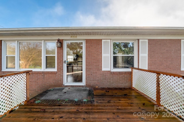 doorway to property with a deck