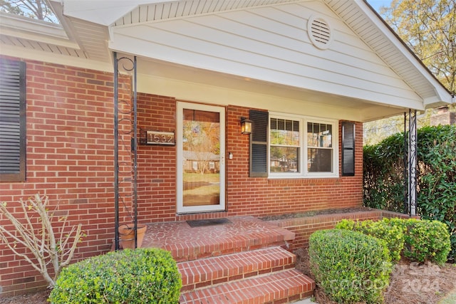 1532 Starbrook Dr, Charlotte, NC 28210 - doorway to property featuring brick siding and a porch