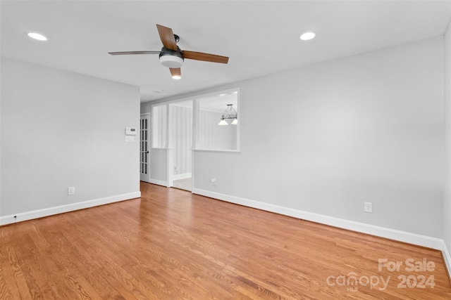 unfurnished room featuring hardwood / wood-style floors and ceiling fan