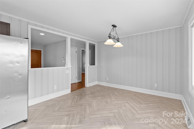 unfurnished room featuring wooden walls, light parquet flooring, and ornamental molding