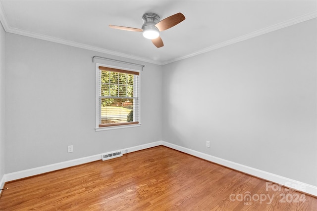 1532 Starbrook Dr, Charlotte, NC 28210 - spare room with baseboards, wood finished floors, a ceiling fan, and ornamental molding