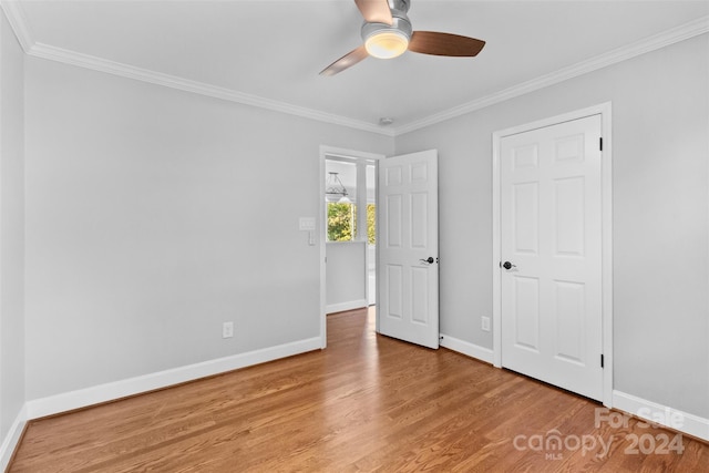 1532 Starbrook Dr, Charlotte, NC 28210 - unfurnished bedroom featuring baseboards, wood finished floors, ornamental molding, and ceiling fan