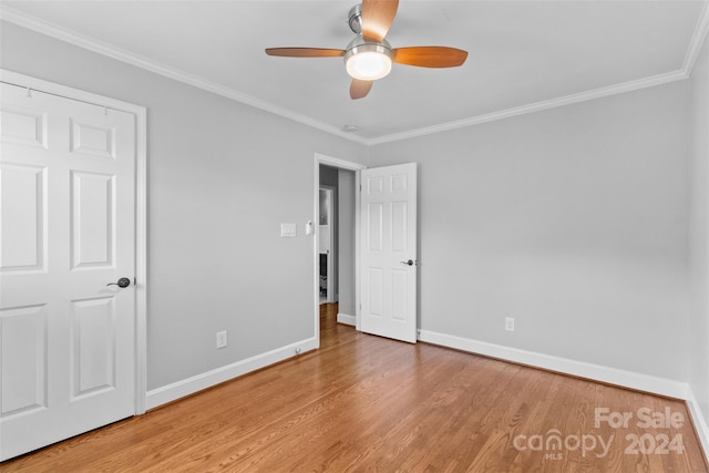 1532 Starbrook Dr, Charlotte, NC 28210 - unfurnished bedroom featuring baseboards, wood finished floors, crown molding, and ceiling fan