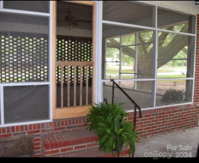 exterior space featuring ceiling fan