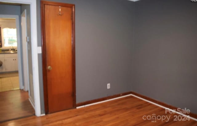 spare room featuring hardwood / wood-style flooring