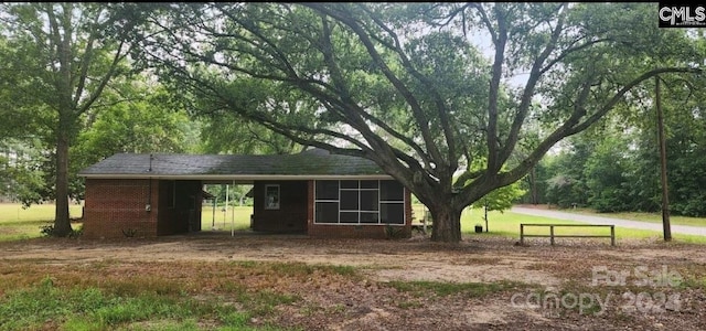 exterior space with a carport