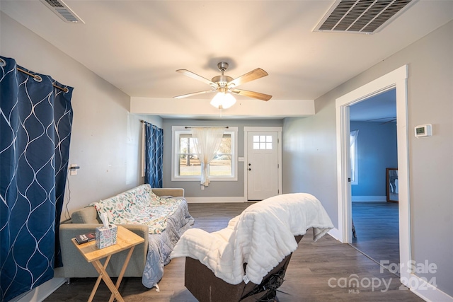 living room with dark hardwood / wood-style floors and ceiling fan