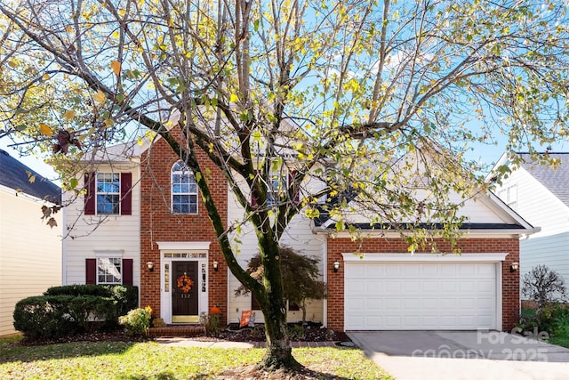 view of front of property with a garage, concrete driveway, and brick siding