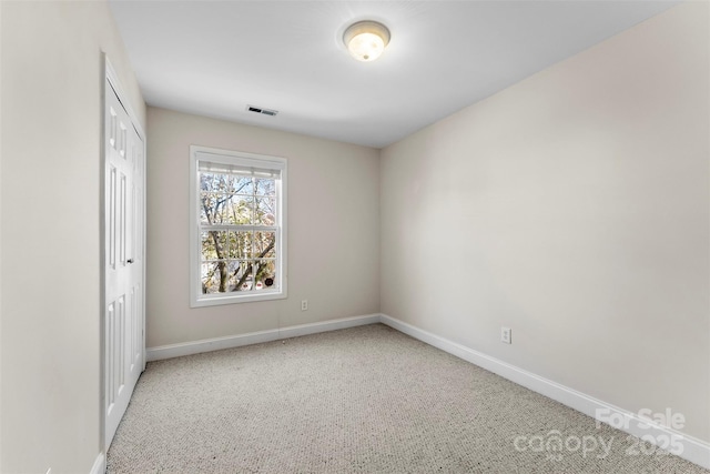 unfurnished bedroom featuring a closet, visible vents, and baseboards