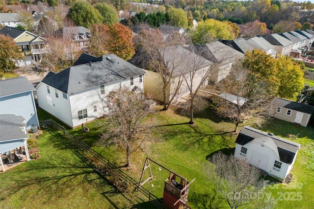 birds eye view of property with a residential view