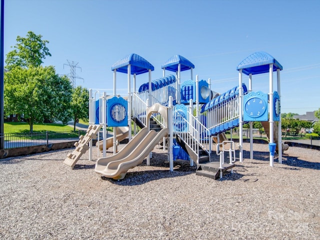 community jungle gym featuring fence