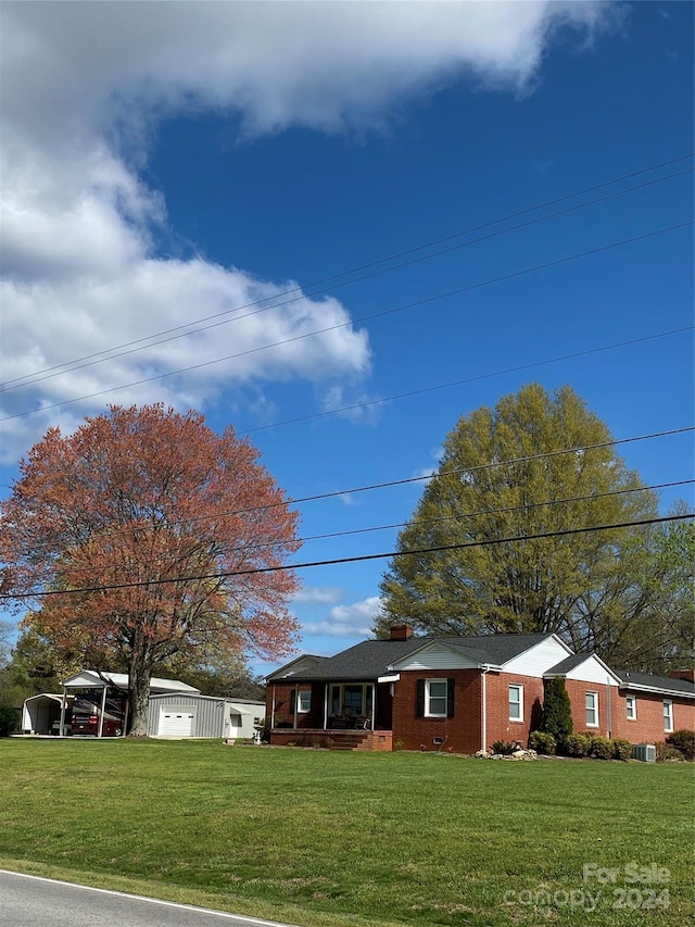 single story home featuring central air condition unit and a front lawn