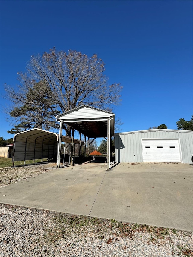 exterior space with a carport and a garage